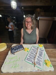 Mrs. Peca with her cake at her retirement party